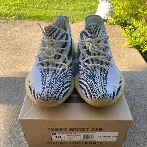 Adidas Yeezy 350 v2 only a couple spots on them other then that great sneaker.